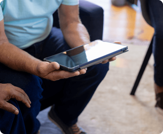 Person using tablet with assistive technology