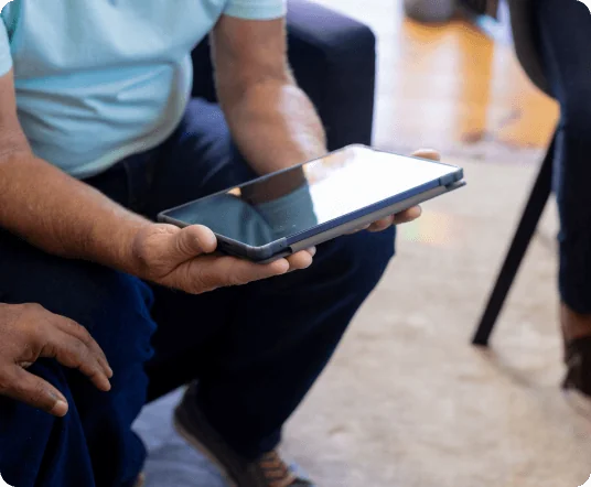 Person using tablet with assistive technology